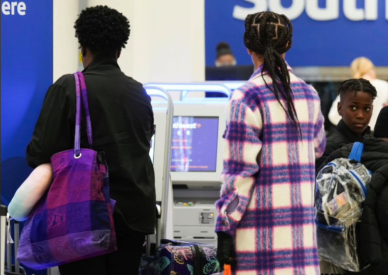 Southwest passengers printing their tickets